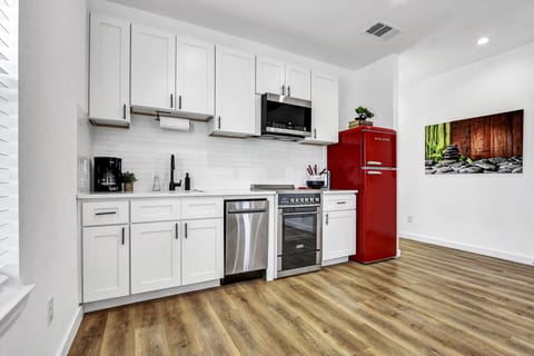 The kitchen features stainless steal appliances