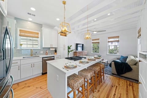 Fully stocked kitchen and living room. High ceilings. Exposed beams.