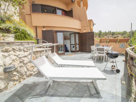 Plant, Property, Sky, Building, Road Surface, Outdoor Furniture, Shade, Chair, Flooring, Urban Design