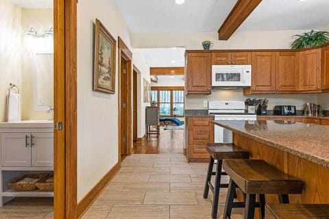 Kitchen and half bathroom (left). Living room is behind you, and dining room is just past the stove.