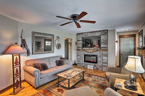 Cozy living room with fireplace, Smart TV, and local South Dakota decor.