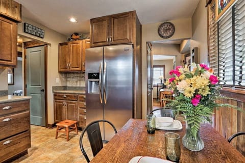 Full-size refrigerator, a cozy coffee bar, and a dining table for 4 people. 