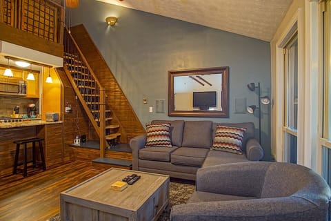 Living room and stairs to loft