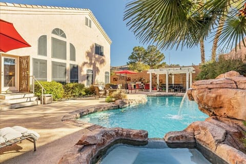 Back yard oasis with pool, hot tub, and plenty of lounging and dining space.