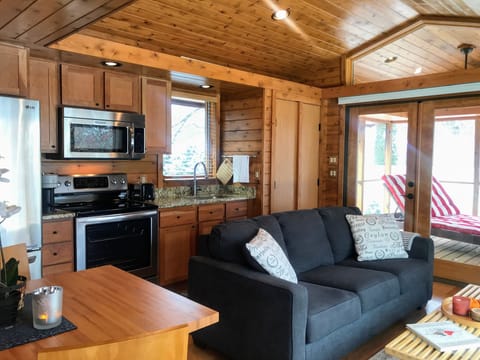 Vaulted ceilings and a large wall of windows give the space an open feeling.