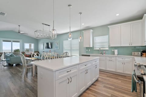 Beautiful wood floors accent beautifully the crisp white kitchen...