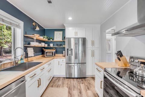 Our meticulously renovated kitchen is fully equipped with high-end appliances.