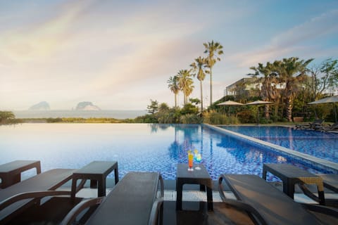 Seasonal outdoor pool, open 10:00 AM to 7:00 PM, sun loungers