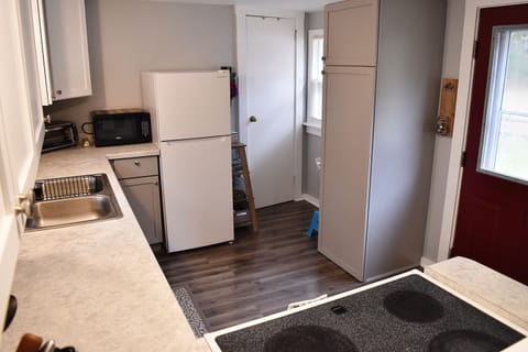 Kitchen includes microwave, toaster oven, coffee maker and blender.
