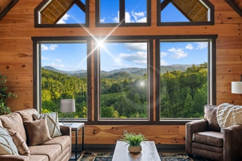 Upper level living room has electric fireplace, smart television, two king bedrooms with ensuite bathrooms, and beautiful views!