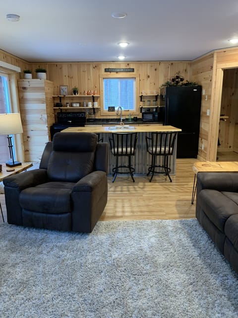 Full view of kitchen w/patio door exit on left. Hot water heater left of stove.