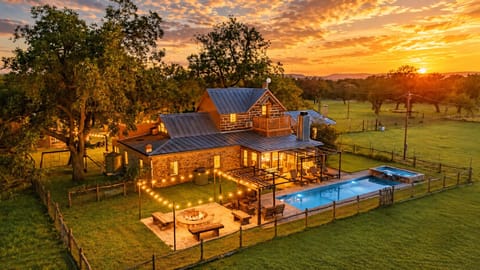 Five-bedroom farmhouse, pool, fire pit, game barn. All yours.