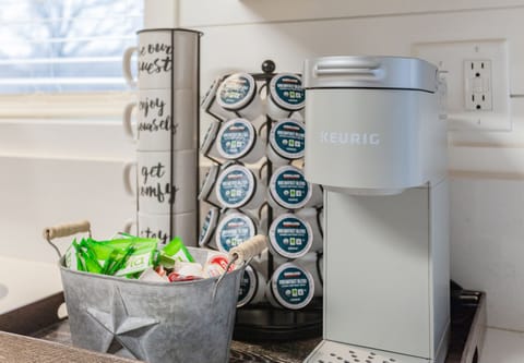 Fully stocked coffee bar with single k-cup keurig coffee maker.