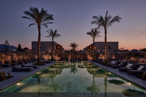 Seasonal outdoor pool, open 9:00 AM to 7:00 PM, pool umbrellas