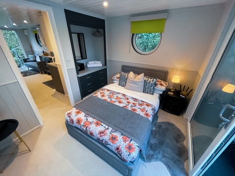 Bedside lamp, draws, hanging rail for clothes and a security safe. 