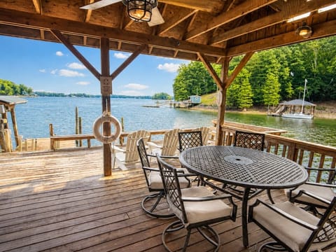 Lakeside deck with pavilion and Adirondacks