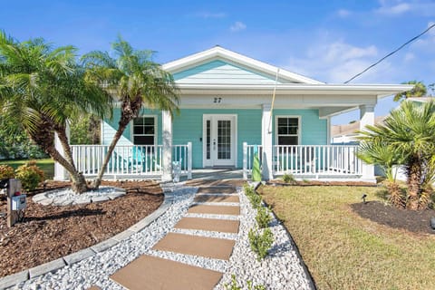 Front entrance in to the home has a large covered porch with sitting area