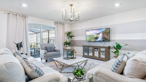 Living Room: Spacious and inviting, the area features a cozy sofas