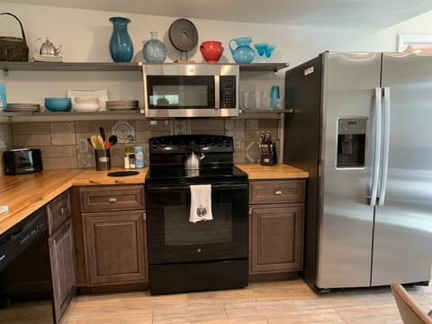 Kitchen. Stocked with all you need to prepare meals.  Just bring food!