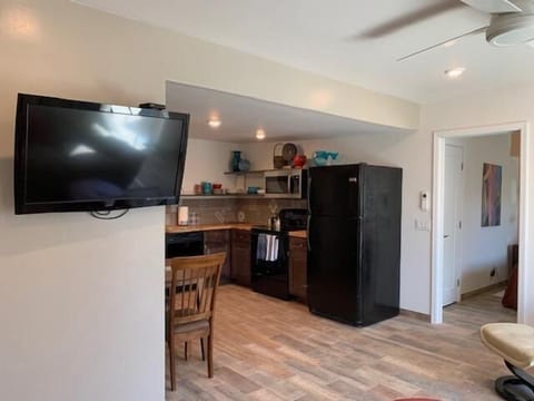 Living room looking toward kitchen and dining area.