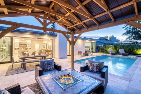 From fire-lit gatherings to starlit swims, this backyard setup brings elegance and comfort to your nights.