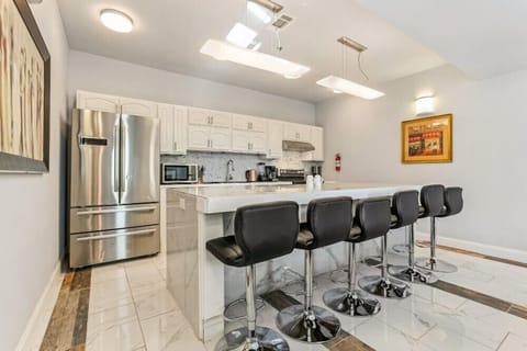 Kitchen area with bar stools
