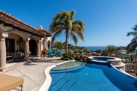 Daytime view of the pool and patio of Villa Maria.
