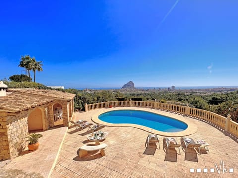 The private 9x5 pool with the Peñon de Ifach behind — the view that greets you every time you step outside.
