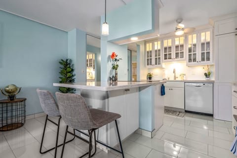 This kitchen features a white diamond designed cabinets 