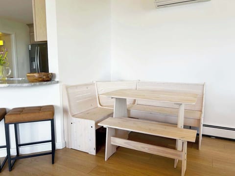 Charming corner bench for relaxed meals and great conversation.