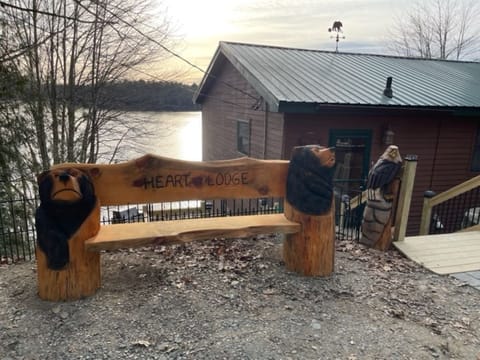 Artwork done by famous chainsaw artist Joe Wenal 2 eagles and bear bench