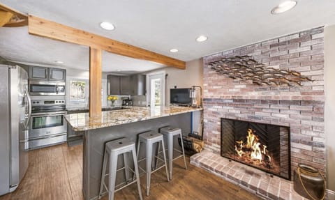 Kitchen and double sided bar top eating area with seating for 6
