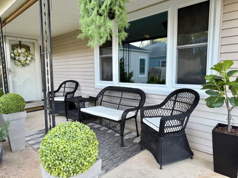 Relax and enjoy our Cozy, Spacious, shady front door.