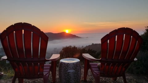 Backyard view: Sun sets over Pedro Point with low fog rolling in.