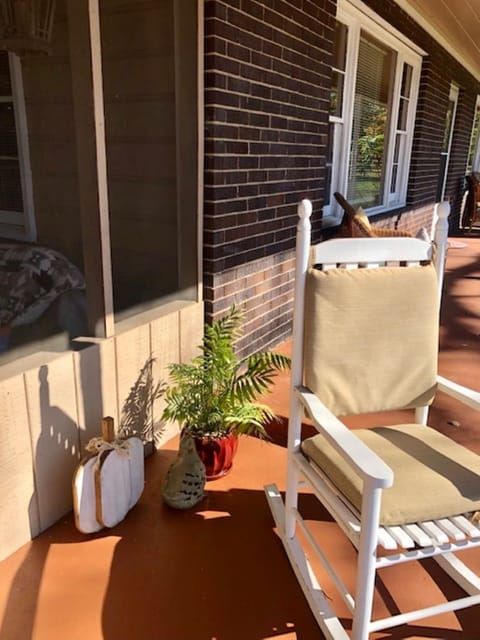 Spend your mornings with a cup of coffee in the front porch rocking chairs