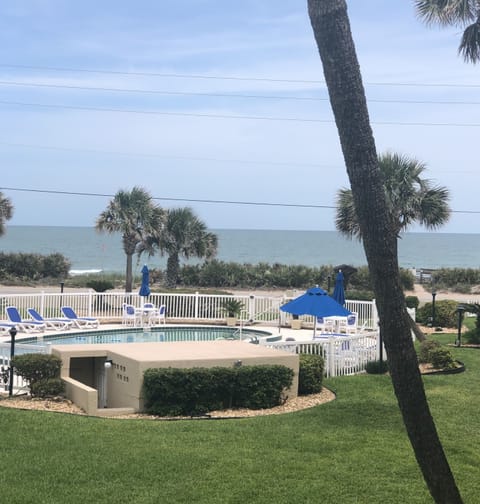 Balcony view of the waves over our sparkling pool 