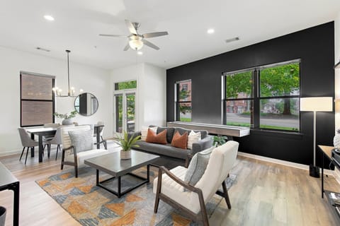 Large living room with Queen pullout couch, Shuffle Board, and dining table. 