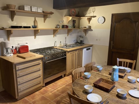 view of the kitchen with its oversized cooking piano