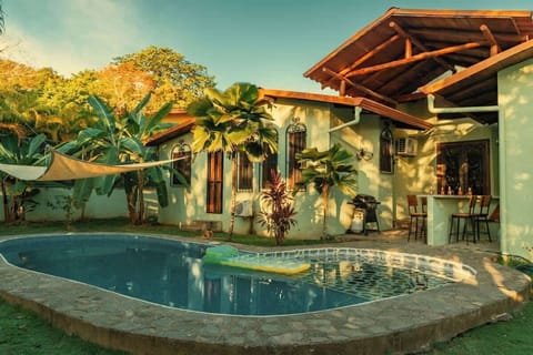 Pool, BBQ and Mini Bar Differentiate This Beach House From Others In The Neighborhood