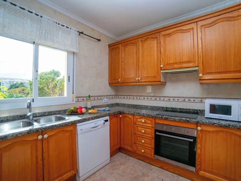 Kitchen, Kitchen Appliance, Countertop, Cabinetry, Major Appliance, Flooring, Wood, Kitchen Sink, Kitchen Stove, Interior Design