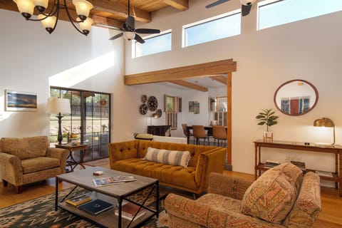 Spacious, light filled living room with wood burning fireplace& smart tv 