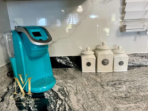 The kitchen offers a Keurig and a drip coffee pots