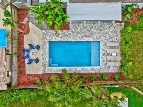 Overhead view of your private backyard oasis, designed for slow mornings and long afternoons by the pool.