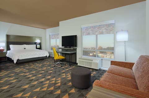 Suite, 1 Bedroom | Desk, blackout drapes, iron/ironing board, free cribs/infant beds