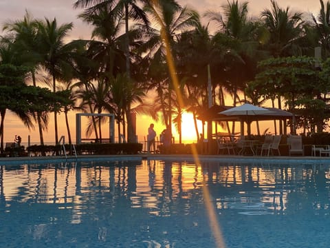 Community Pool that has a swim up bar with amazing food and drinks. 