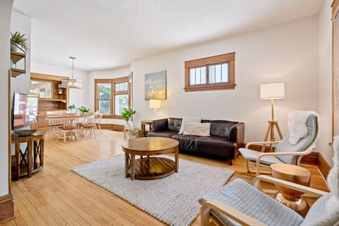 Settle in -- the living room is cozy and bright.