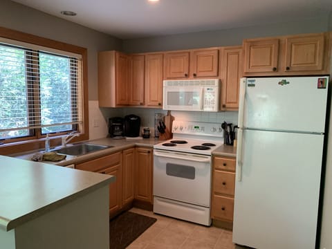 Upstairs kitchen - Everything you need to dine and cook, one of two kitchens