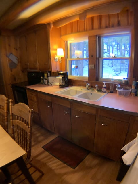 Kitchen view, appliances, stove and countertop. 