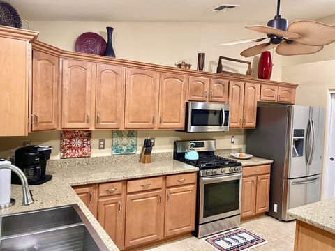 Gas range, granite counters and island (seats 6), stainless steel appliances.