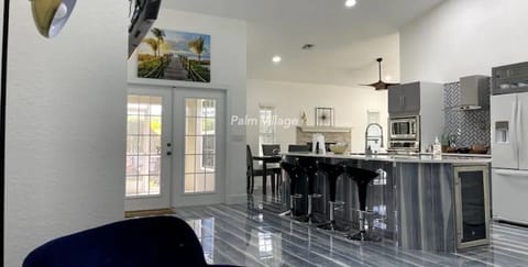 Porcelain floors with a Wine Cooler, Bar Stools Pop up wireless charger + more!